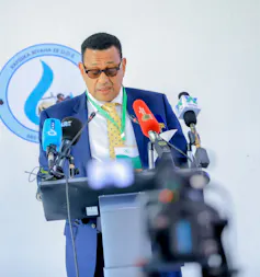 A man speaks into a microphone