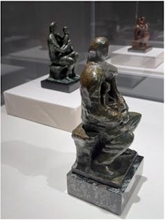 Photograph of statues of people huddled together