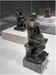 Photograph of statues of people huddled together