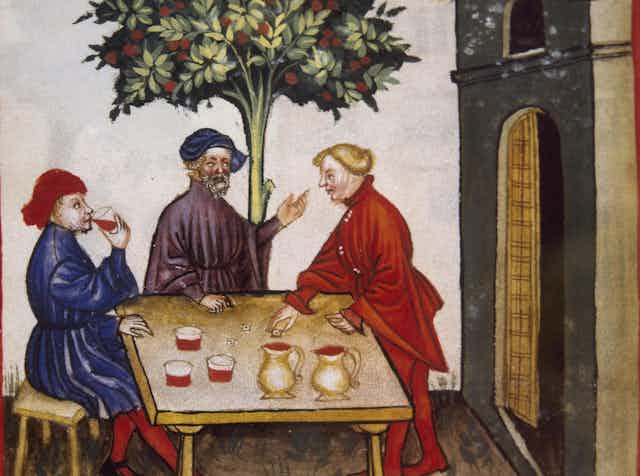 Three men drinking and chatting