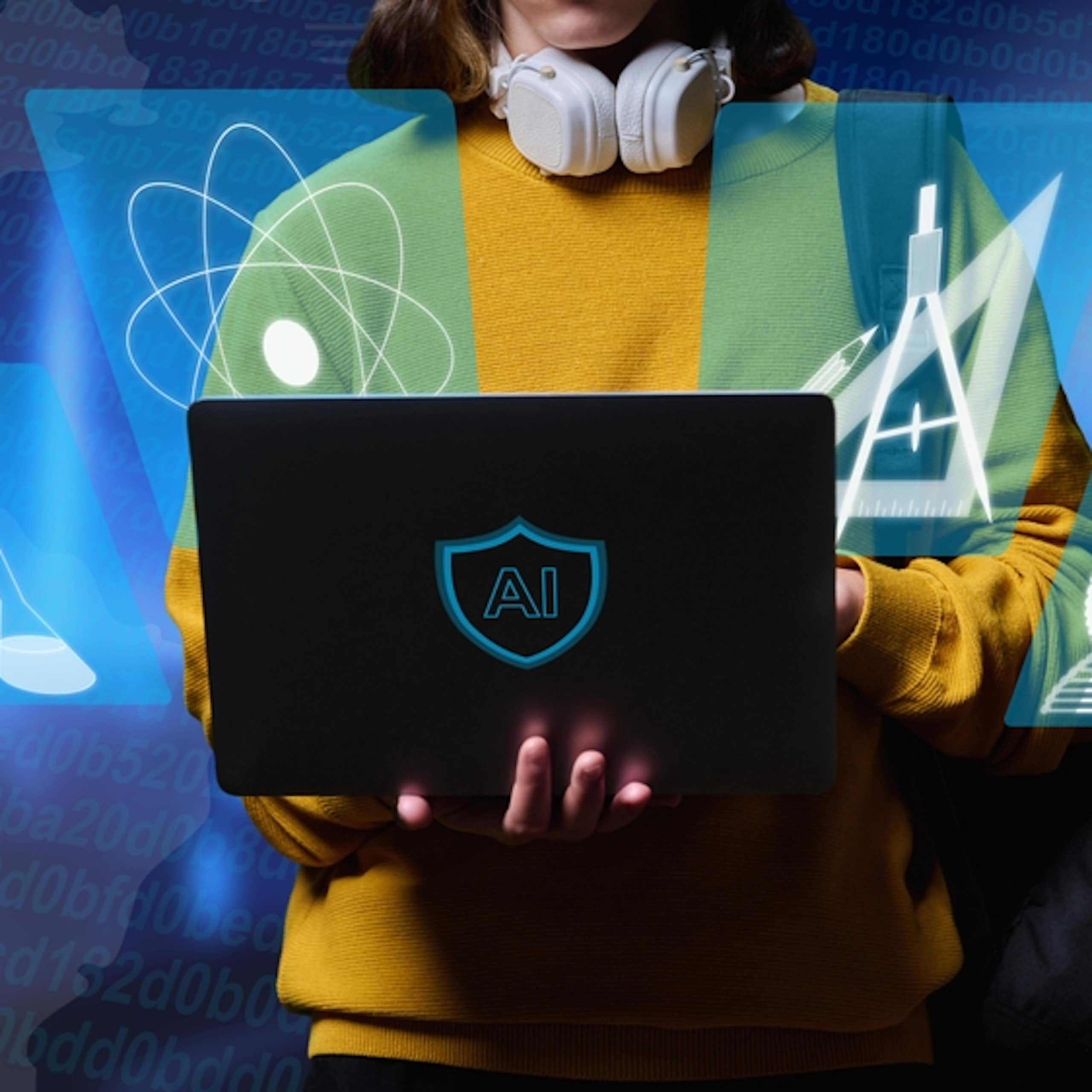 Un élève tenant un ordinateur et faisant des exercices scolaires en ligne