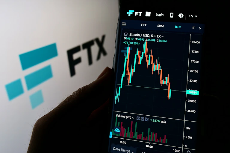 FTX logo and a phone screen showing FTX prices