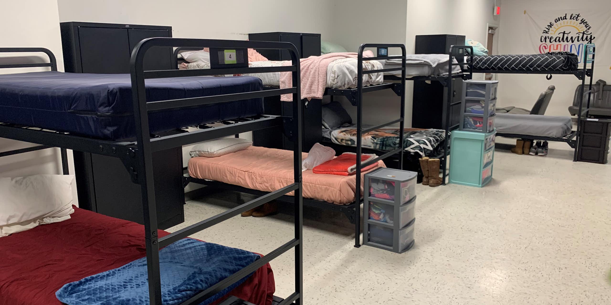 Bunk beds and lockers in a dormitory-style room