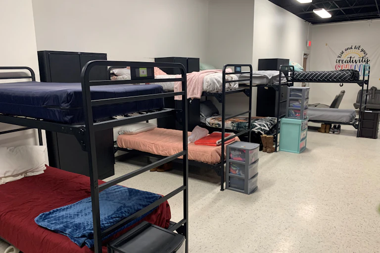 Bunk beds and lockers in a dormitory-style room