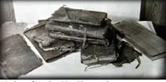 A collection of ancient texts on a table.