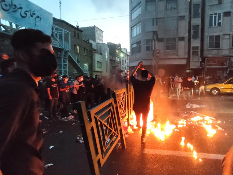 Protesters clash with police in Tehran, 2022.