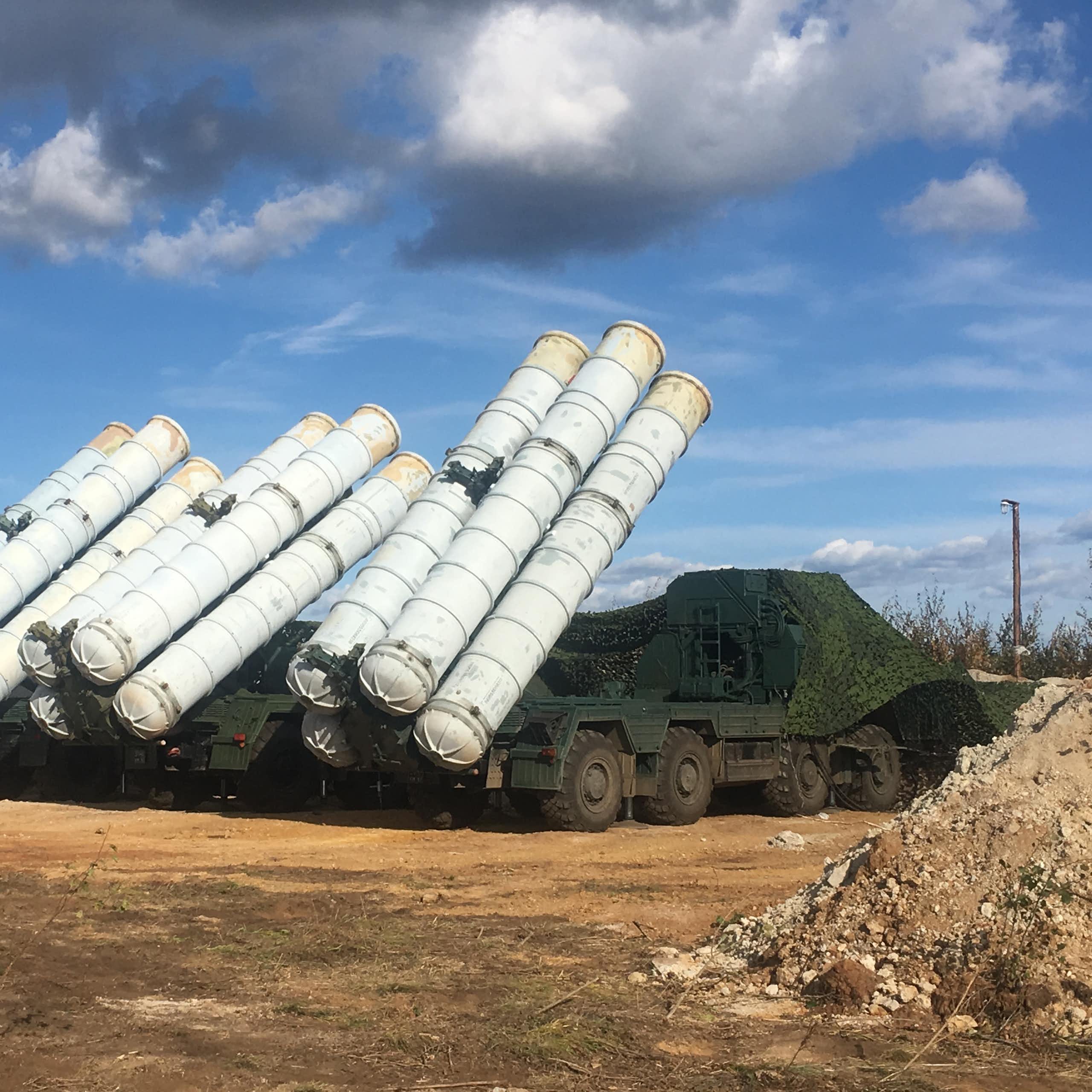 Photo of a large truck with several missiles on its back.