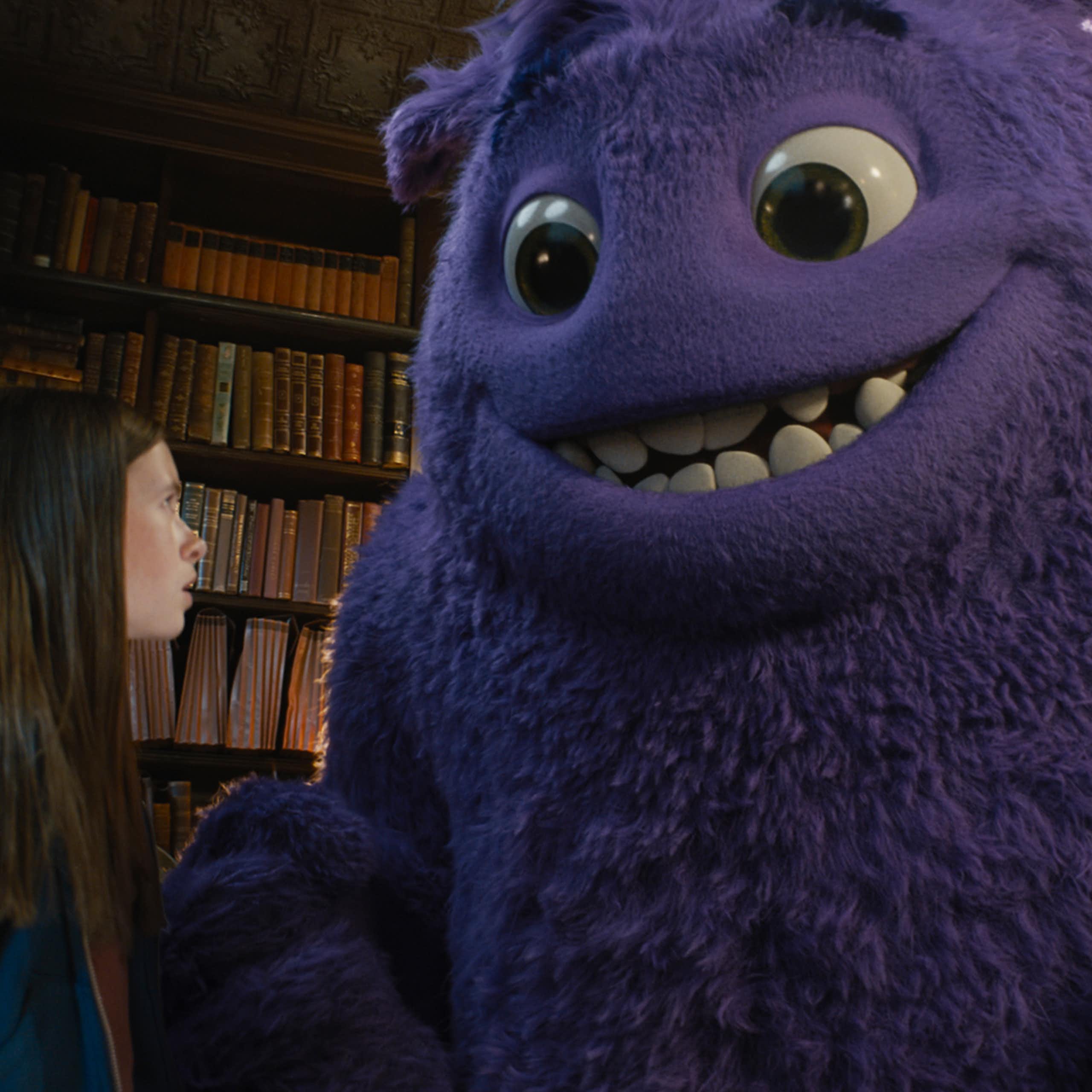 Image of girl with large furry purple creature