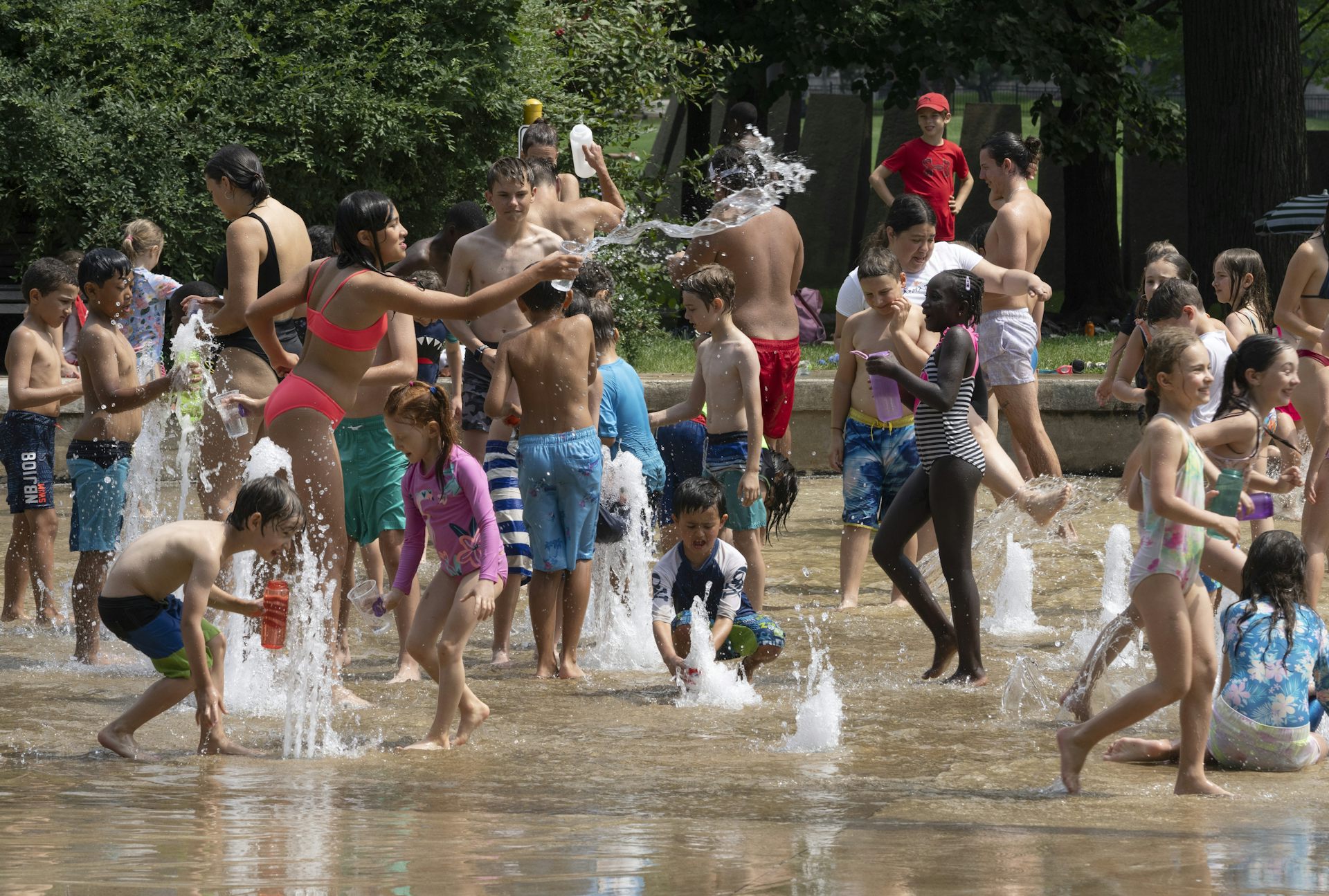 Children play in water games in Montréal