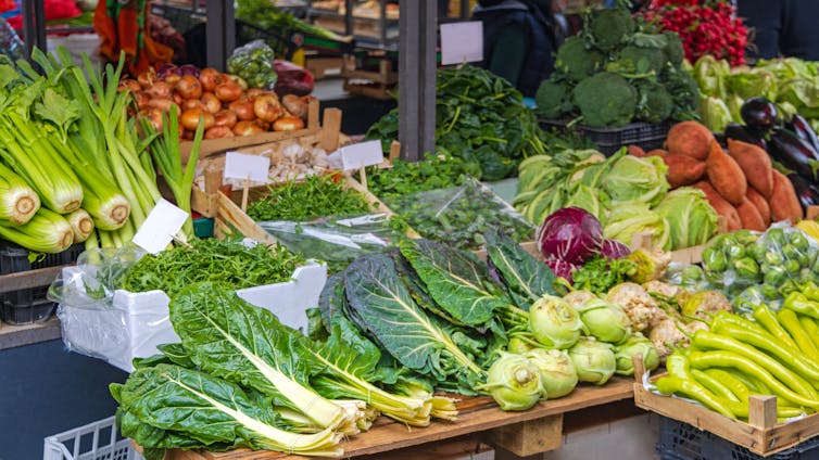 Fresh vegetables on display at a farmer's market stall