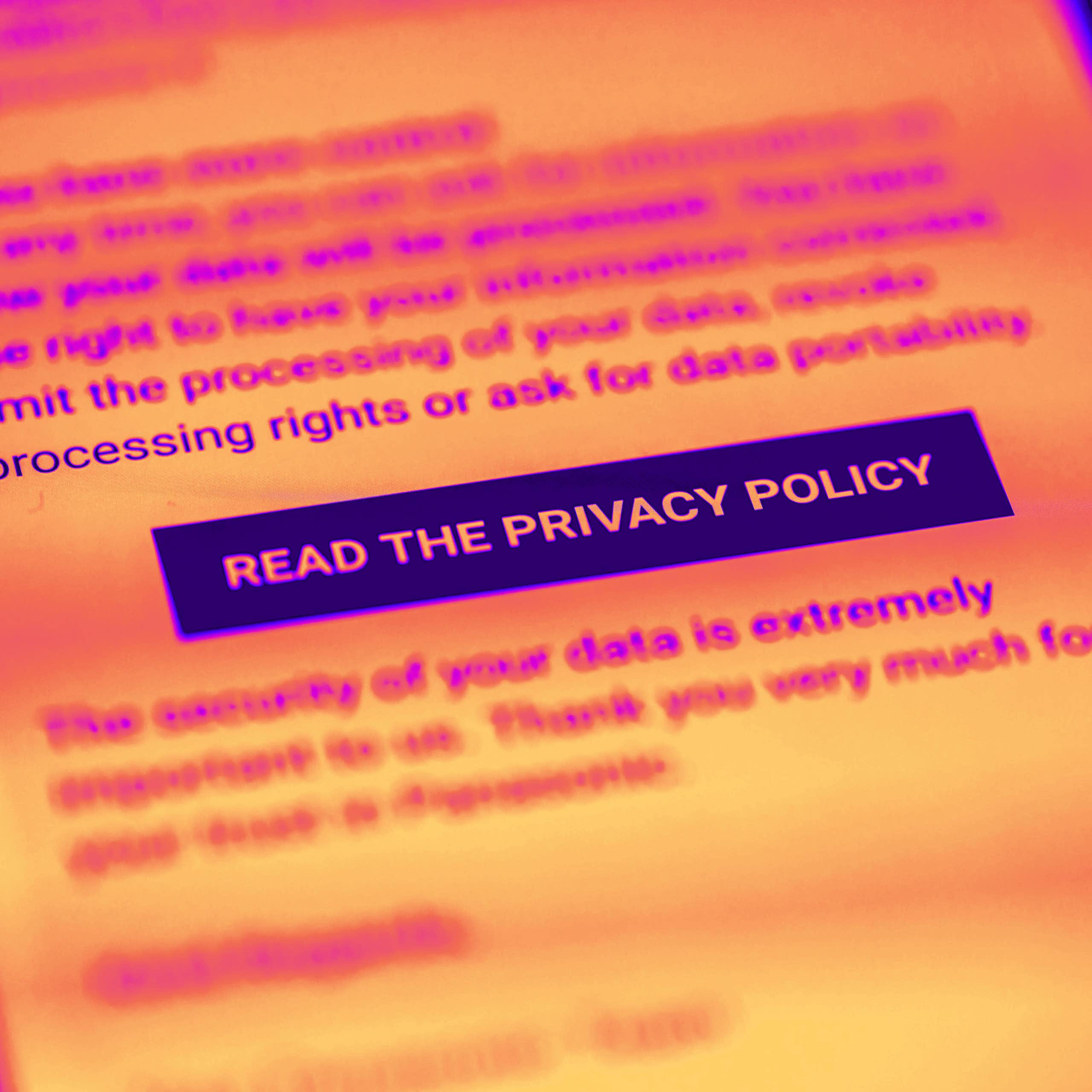 A brightly coloured photo of a smartphone screen displaying a button asking to a read a privacy policy.