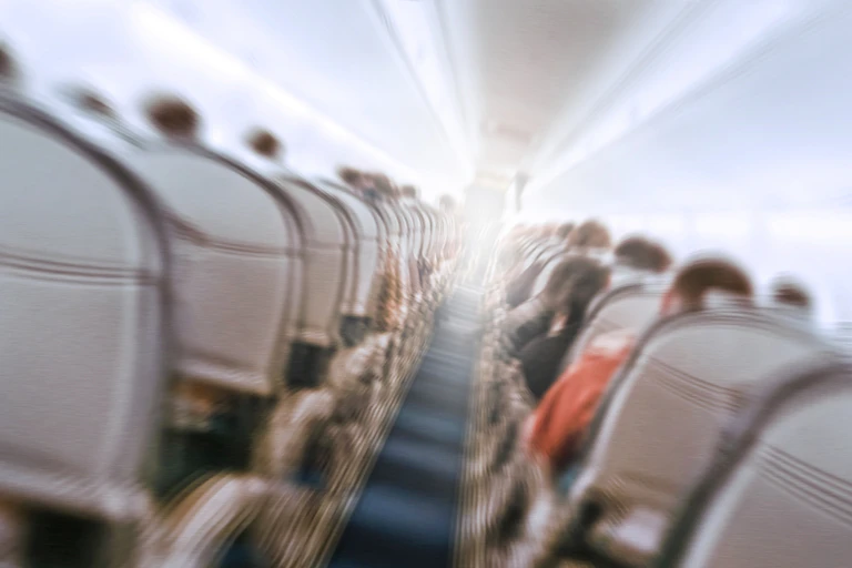 Shaky, blurred image of inside of plane