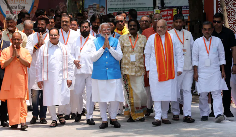 Narendra Modi walking with other officials.
