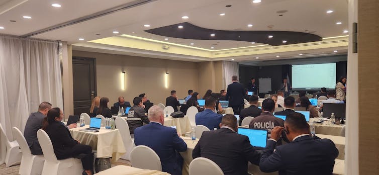 Officials at work on computers