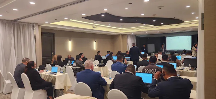 Officials at work on computers