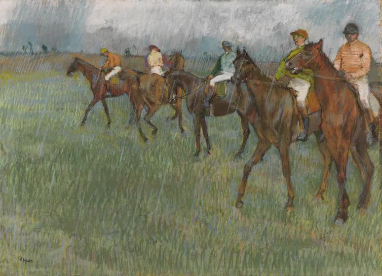 An Impressionist painting by Edgar Degas of bunch of jockeys lining up for a race in the rain.
