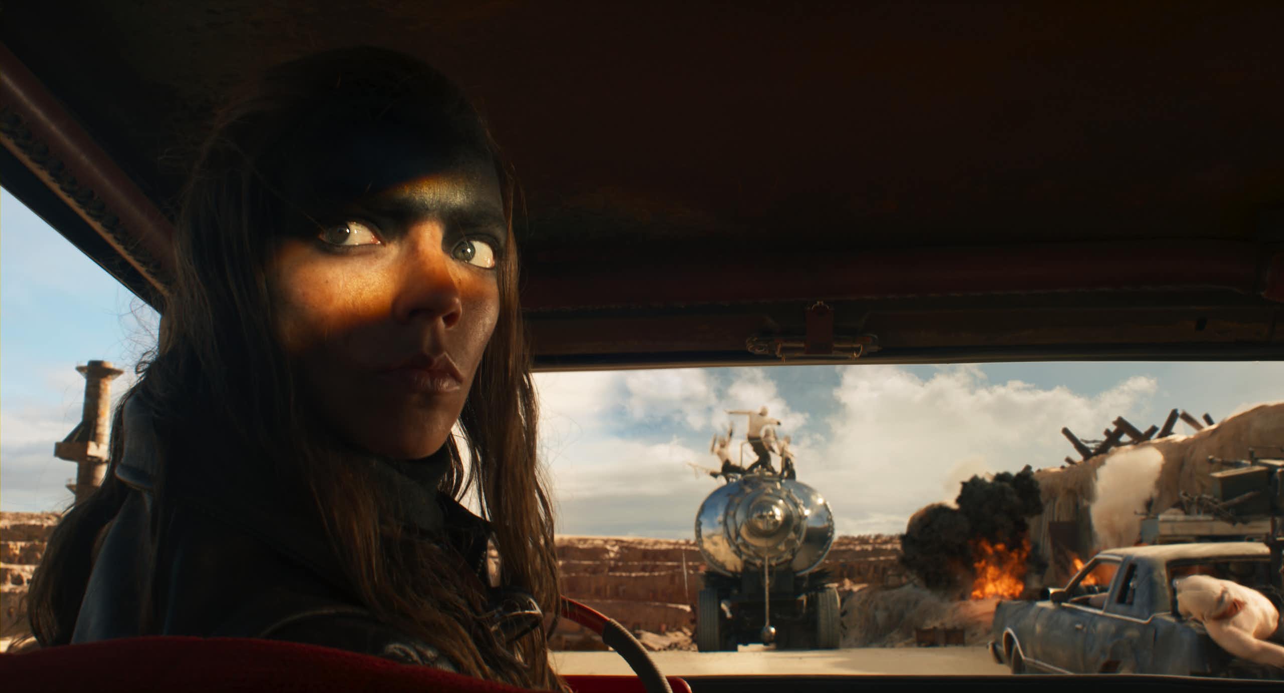 A still from the movie featuring lead actress in a truck cab.