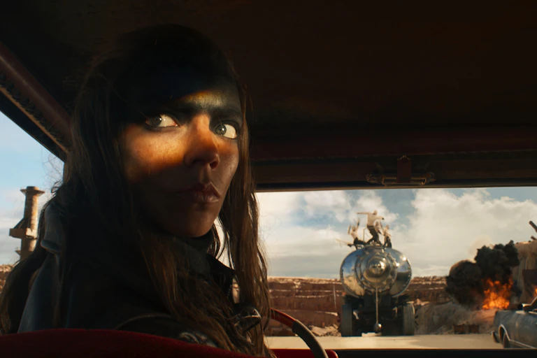 A still from the movie featuring lead actress in a truck cab.