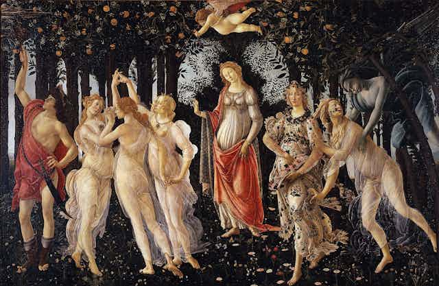 A painting showing several nypmhs, goddesses and men in an orchard. In the middle is Aphrodite. 