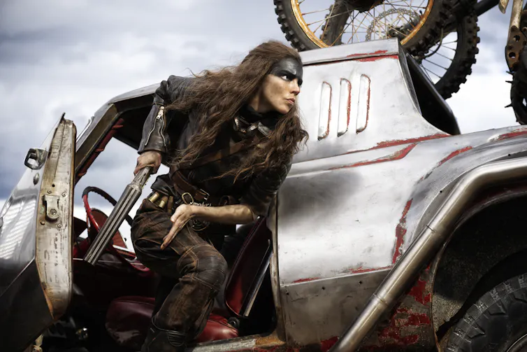 Furiosa on a speeding car.