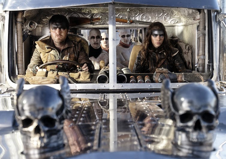 Two characters in a truck.