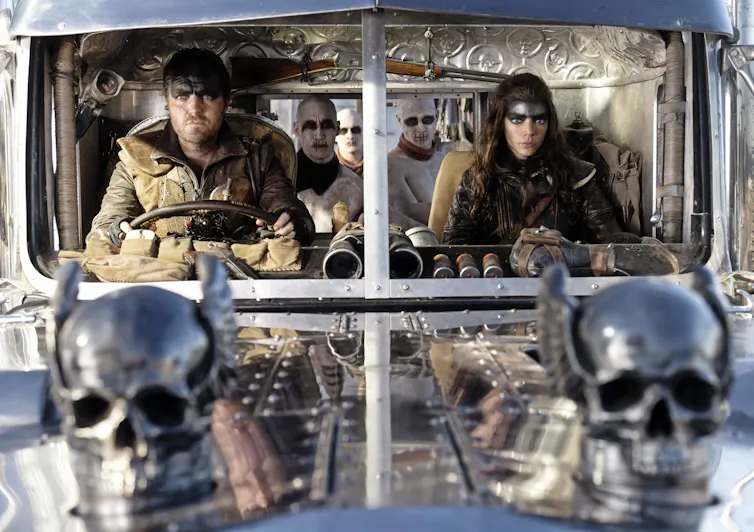Two characters in a truck.