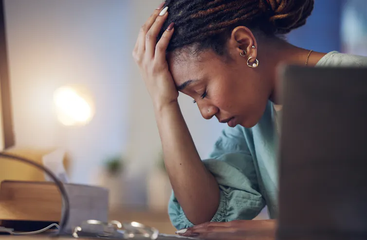 Business woman being depressed and stressed in an office.