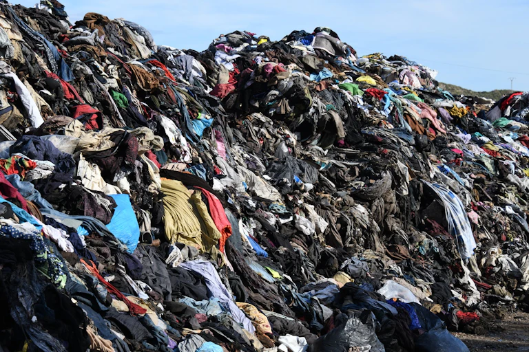 Clothing waste seen on a heap.
