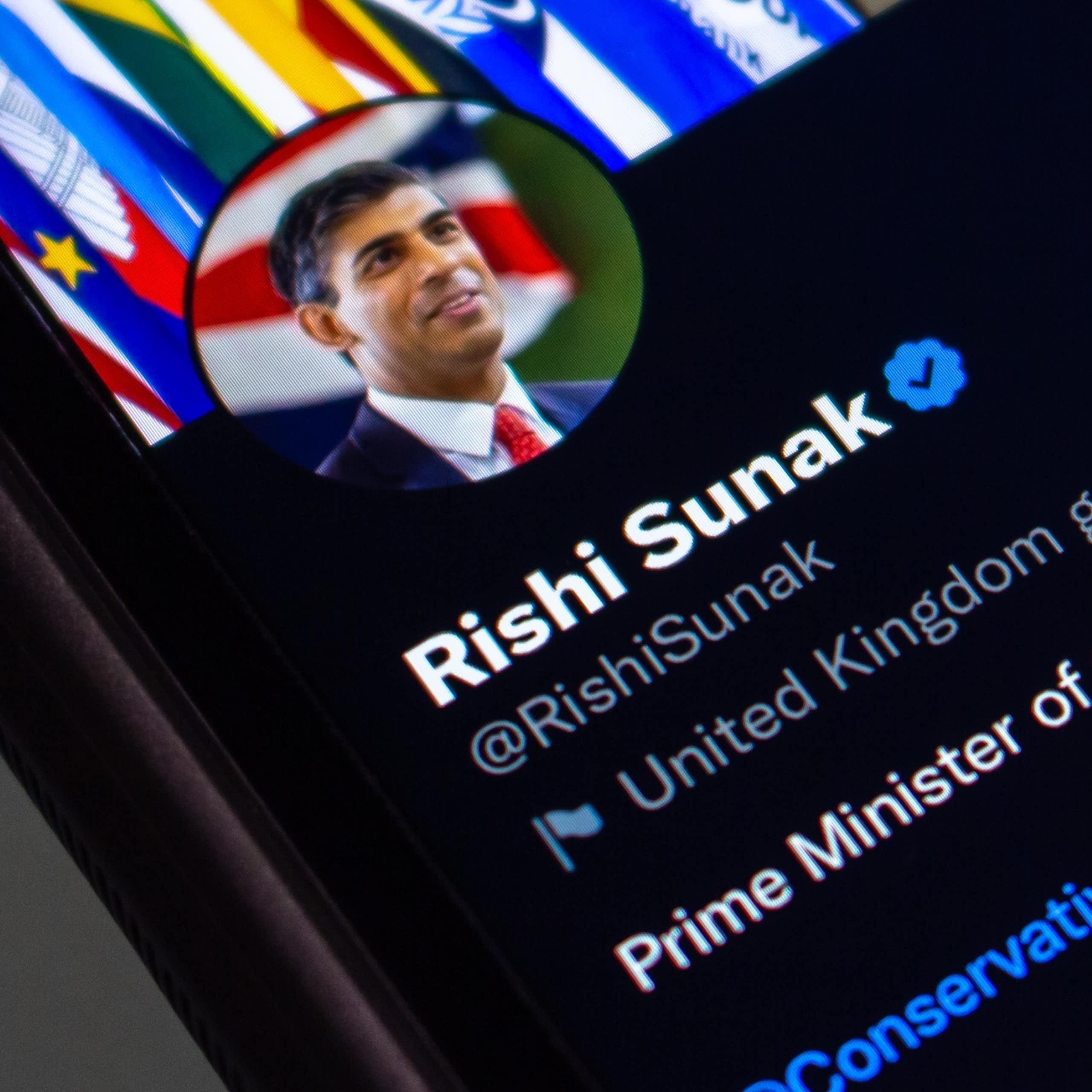 Photo of a mobile phone with Rishi Sunak's Twitter profile pulled up