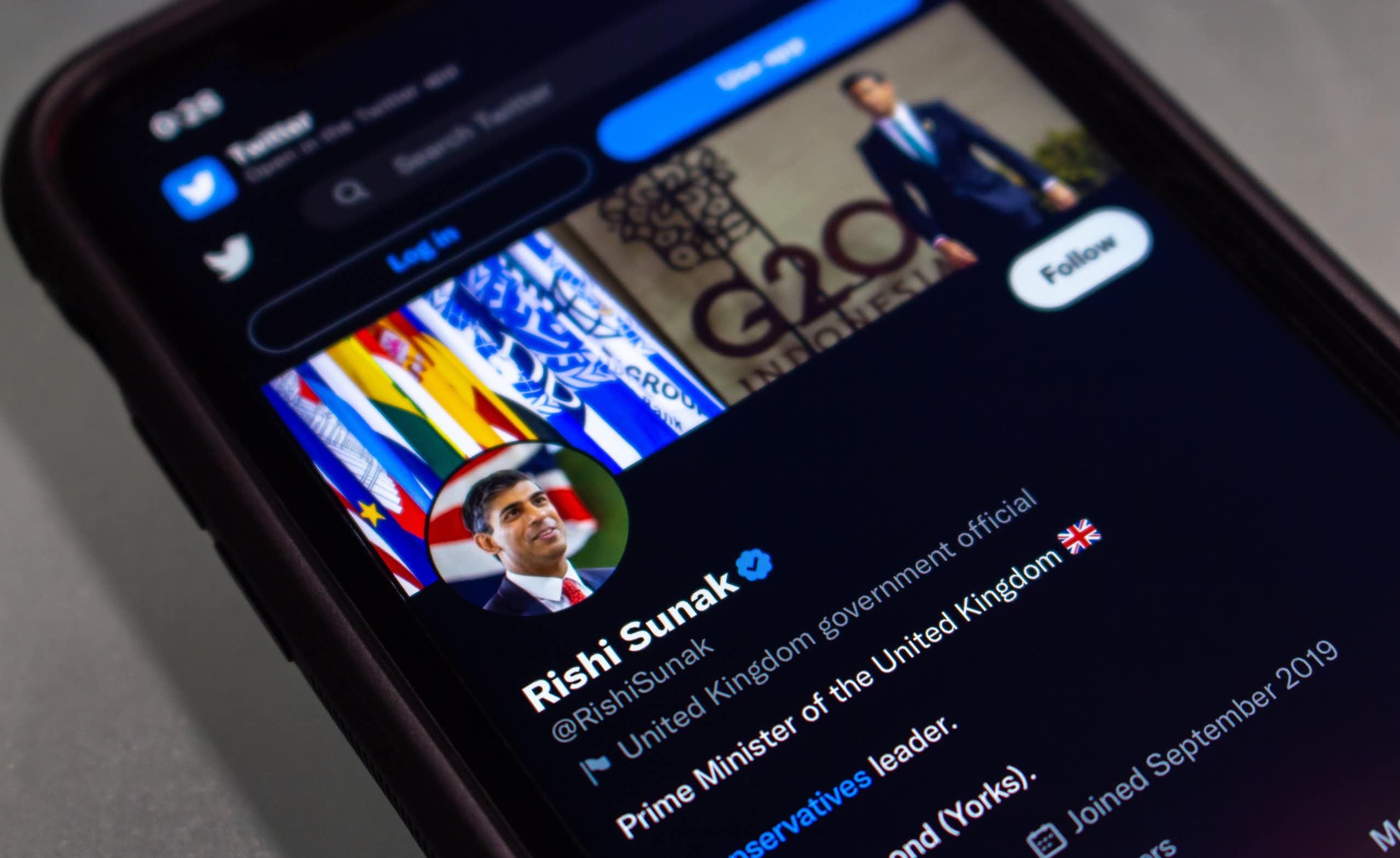 Photo of a mobile phone with Rishi Sunak's Twitter profile pulled up