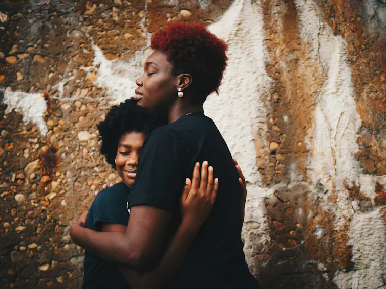 Mother and child hug