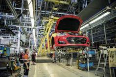 Red car on a factory assembly line in Adelaide