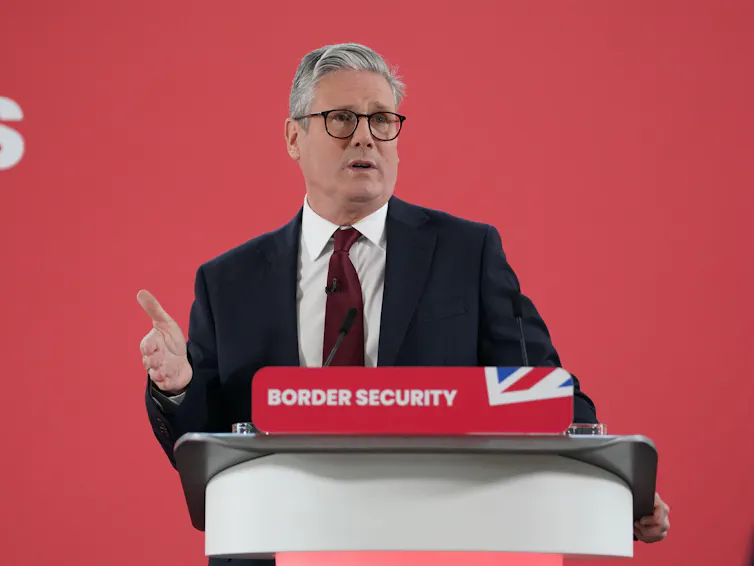 Keir Starmer speaking at a podium that reads 'border security'