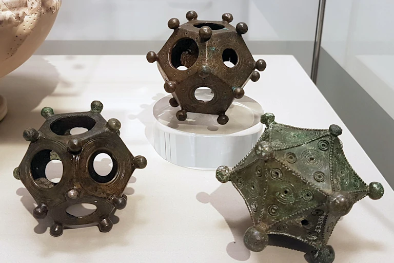 Two dodecahedra and an icosahedron on display.