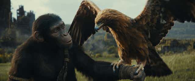 A CGI ape holding an eagle.