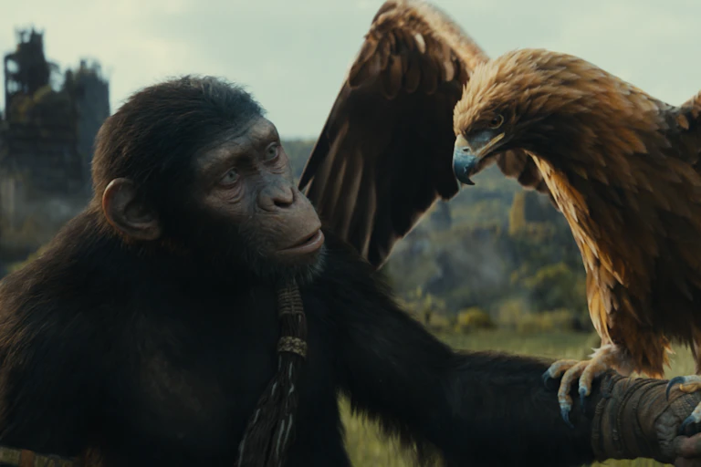 A CGI ape holding an eagle.