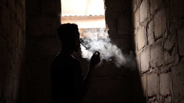 Gaz takes a smoking break during an interview session