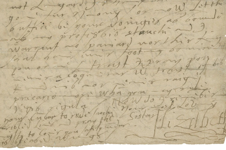 The bottom half of a page of a letter in the handwriting of Queen Elizabeth I. Elizabeth’s signature is visible in the bottom right corner of the letter. The paper, now tan colored, is inscribed in brown ink. The text gets increasingly compressed towards the bottom of the letter. There are several creases on the page, suggesting how the letter may have been folded when originally sent.