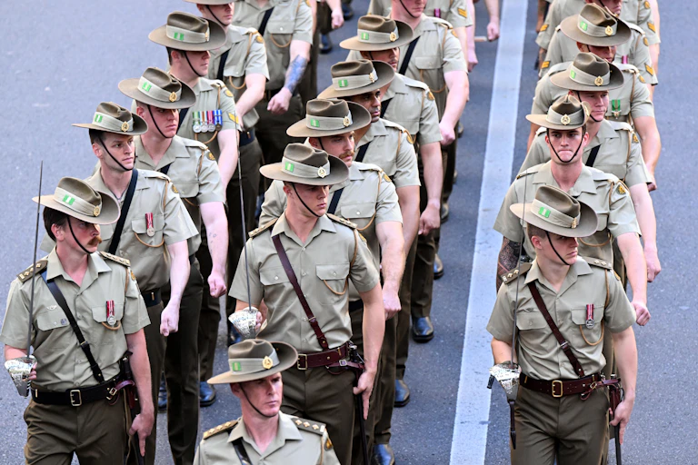 Three rows of Australian soldiers marching