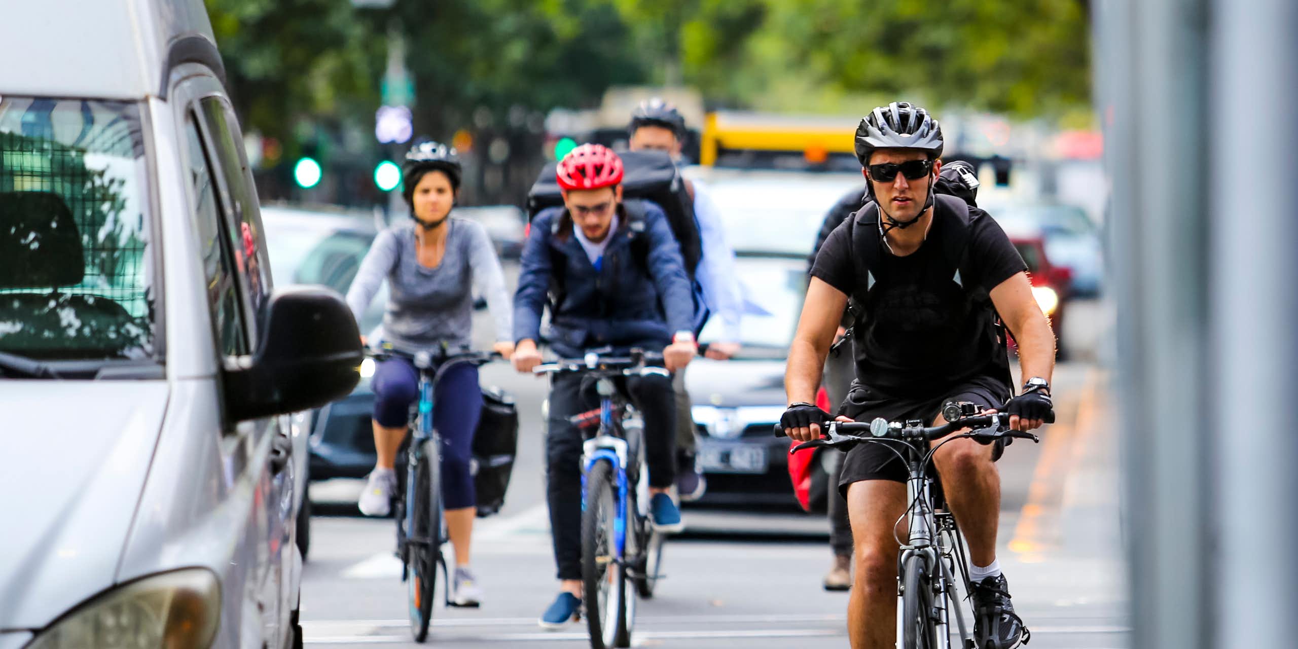 Cyclists commute among the traffic in Melbourne