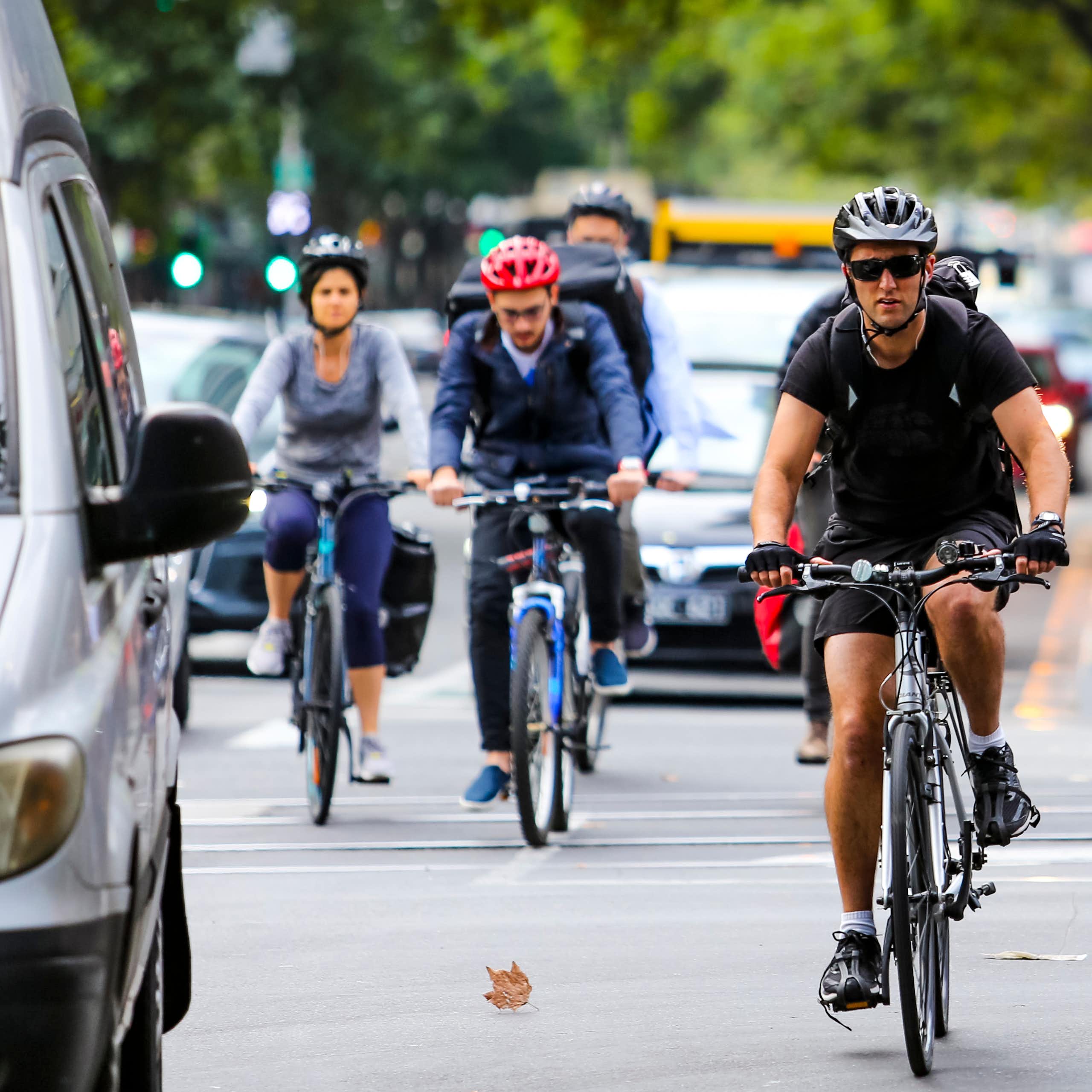 Cyclists commute among the traffic in Melbourne
