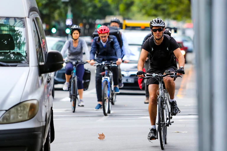 Cyclists commute among the traffic in Melbourne