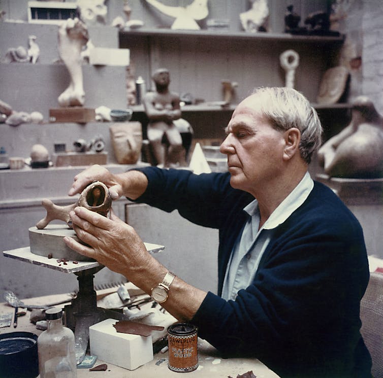 Henry Moore working in his maquette studio.