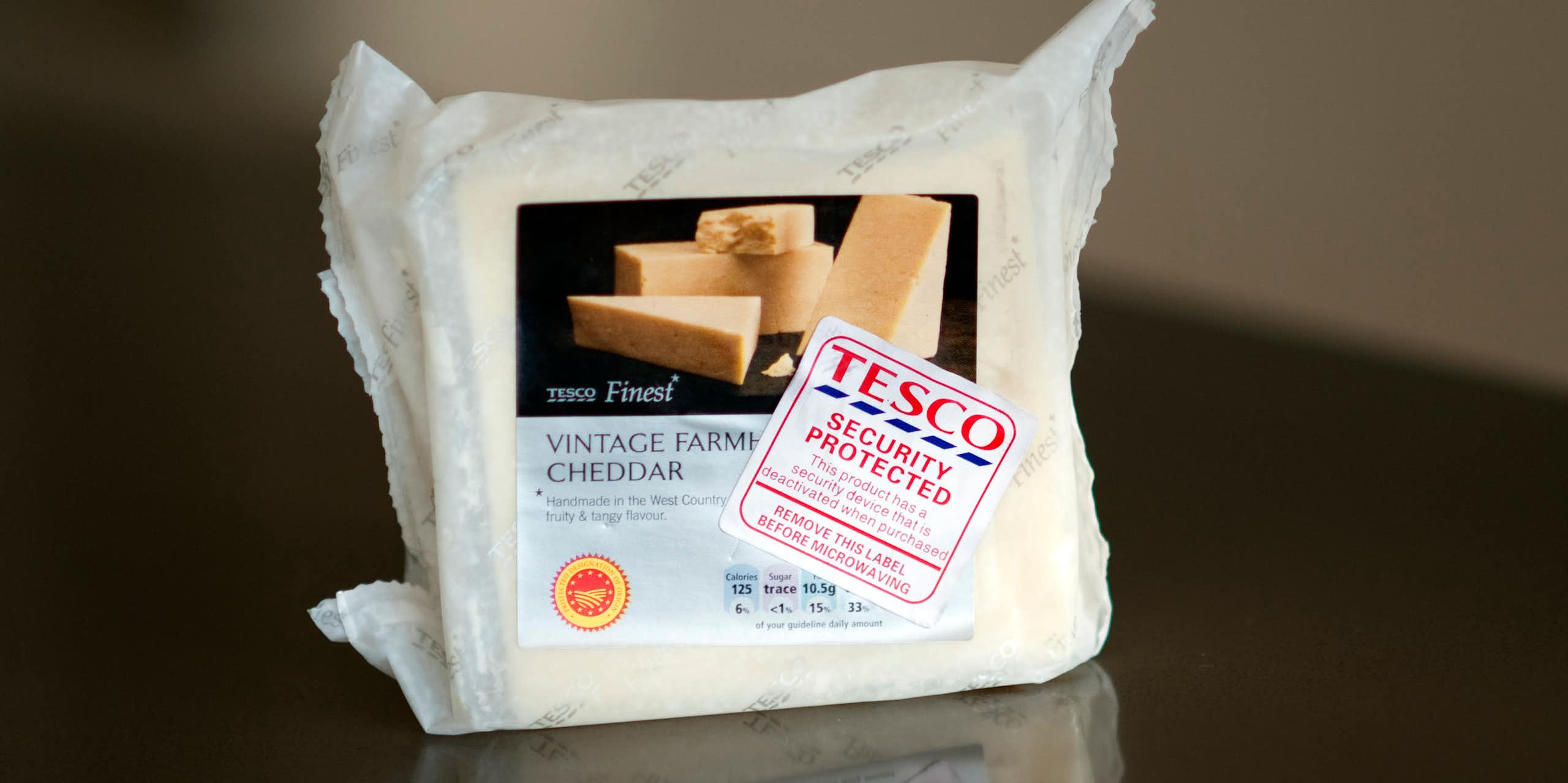 packet of cheese with a security tag attached