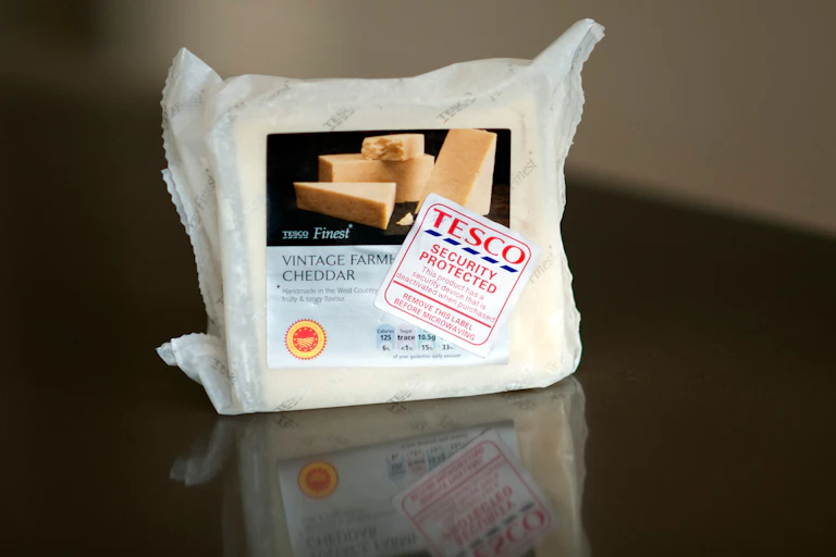 packet of cheese with a security tag attached