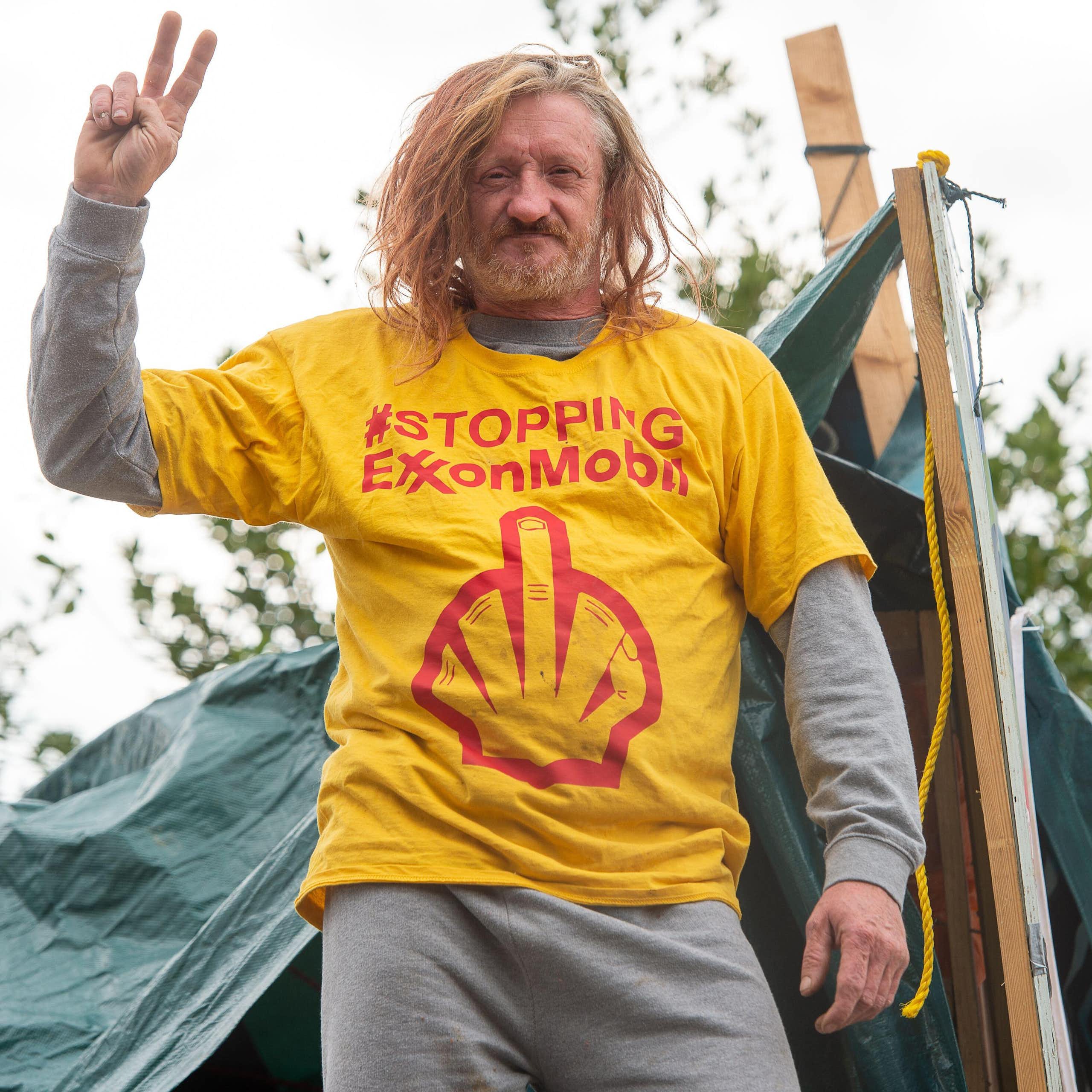 Hippy protesting against Exxon