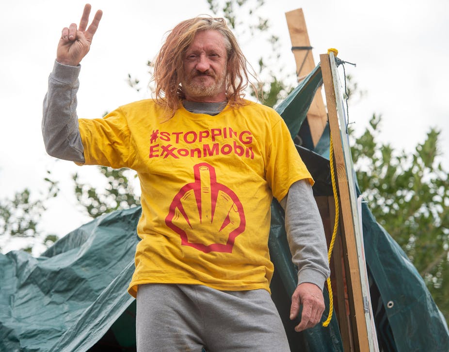 Hippy protesting against Exxon
