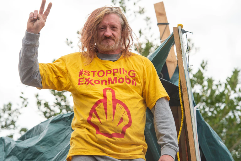 Hippy protesting against Exxon
