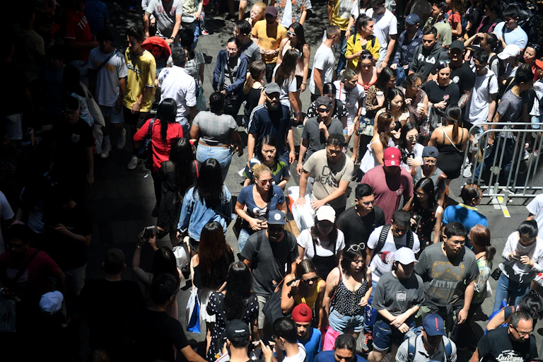 A dense crowd of diverse people