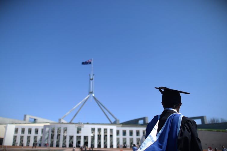 University graduate seen out the front of Parliament house